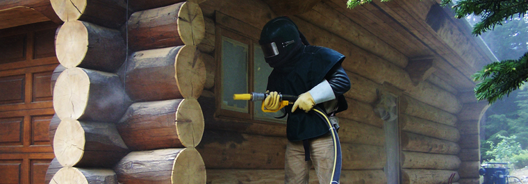 image of man glass blasting